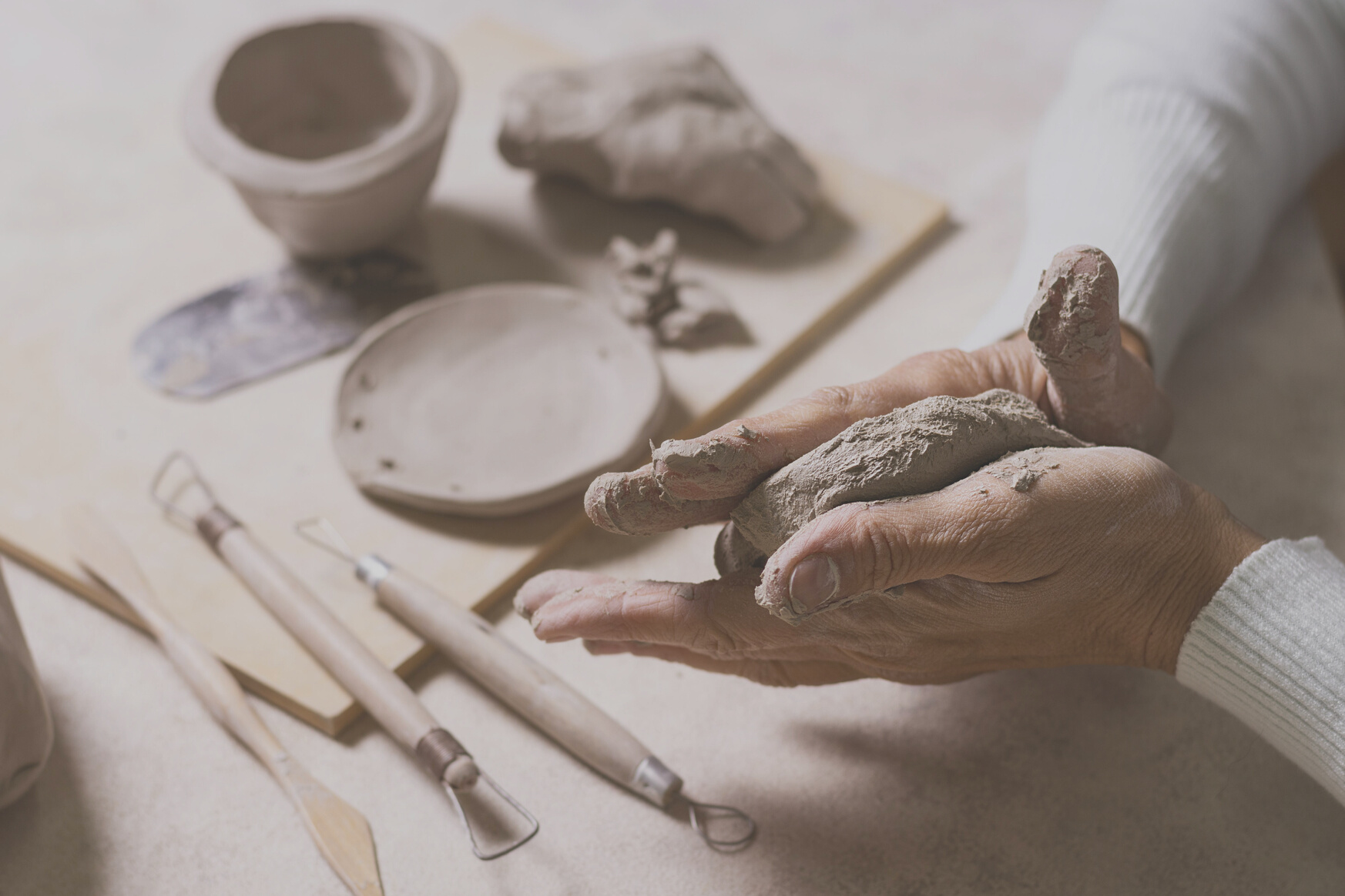mixing clay pottery pot